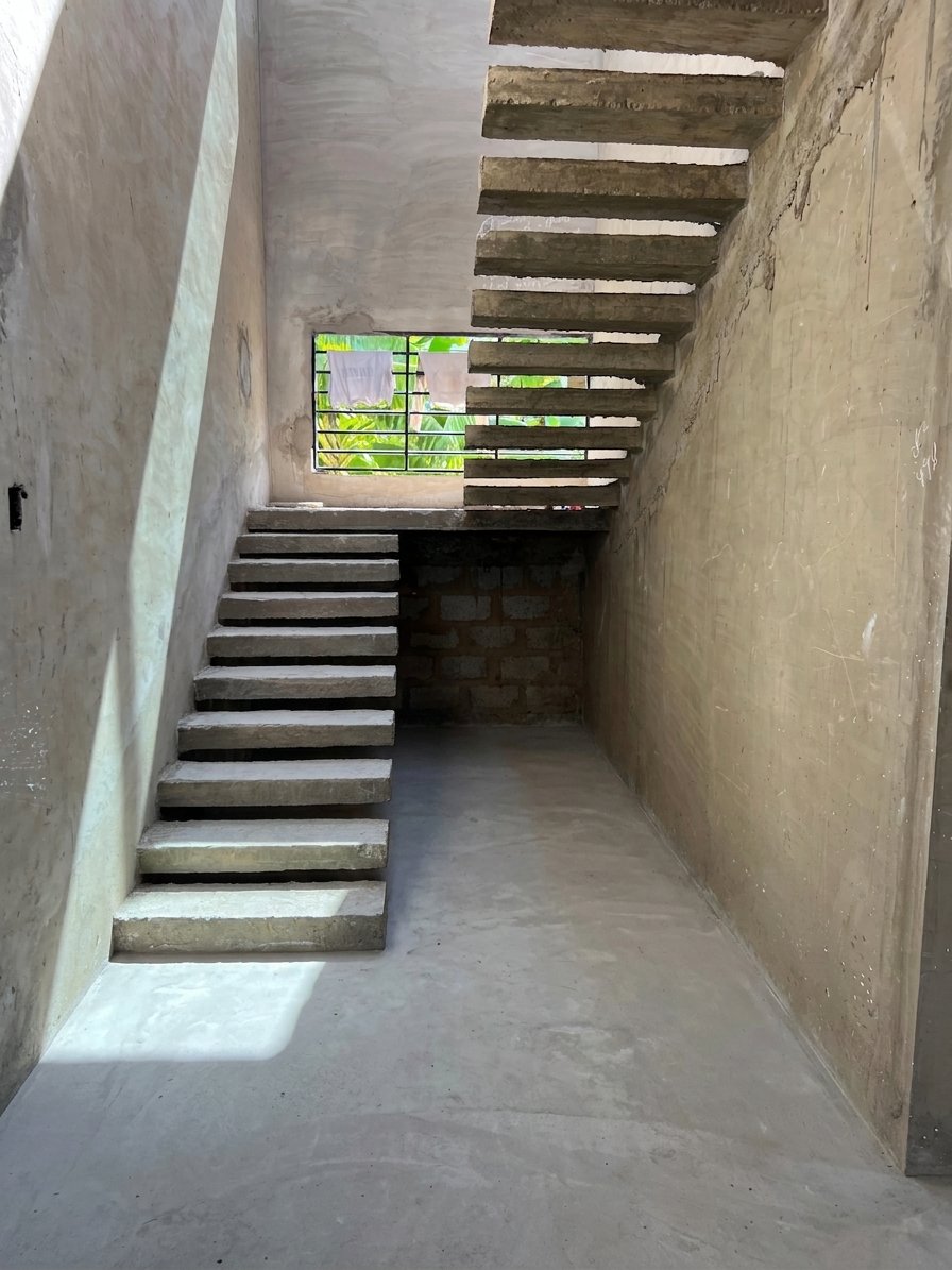 Reinforced concrete floating staircase under construction inside a private residence at Gbawe, Accra